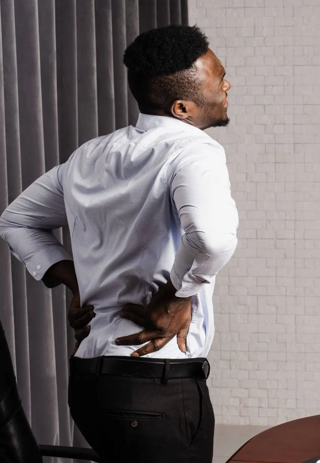 Man with disc injury experiencing back pain